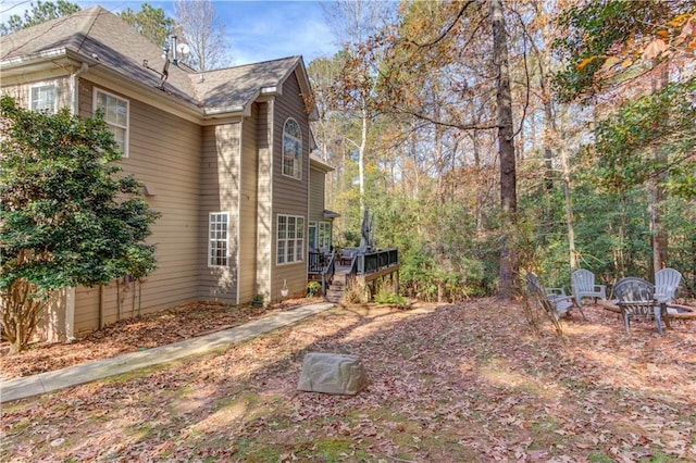 view of yard featuring a wooden deck