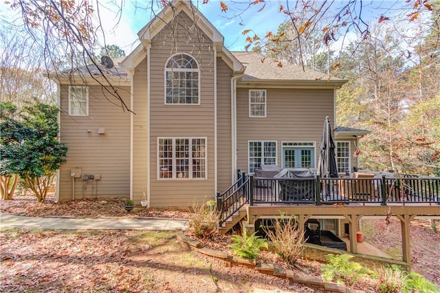 back of house featuring a deck