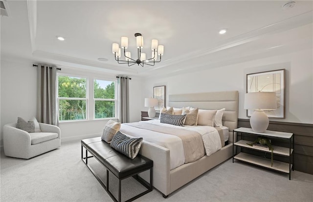 carpeted bedroom featuring crown molding, a tray ceiling, a notable chandelier, and recessed lighting