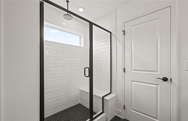 bathroom with a shower stall