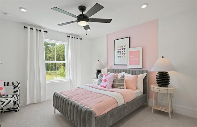 bedroom with a ceiling fan, recessed lighting, light carpet, and baseboards