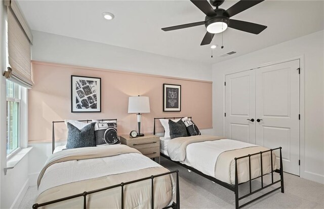 bedroom featuring recessed lighting, light carpet, a ceiling fan, visible vents, and a closet