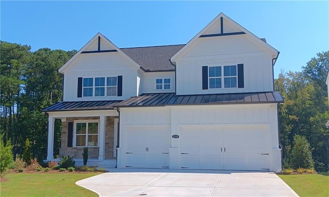 modern farmhouse with a garage and a front yard