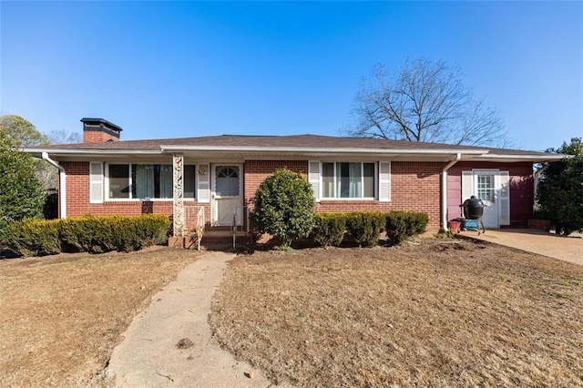 single story home featuring a front yard and a carport