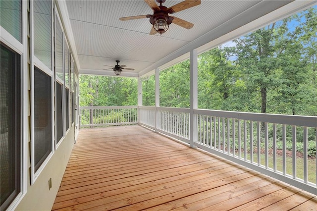 wooden terrace featuring ceiling fan