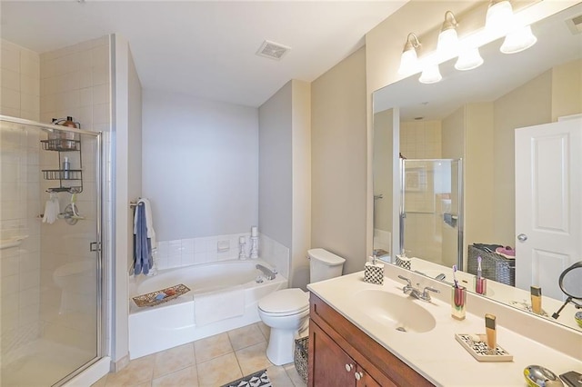 full bathroom with tile patterned flooring, separate shower and tub, vanity, and toilet