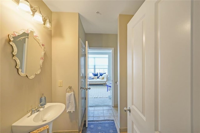 bathroom with tile patterned flooring and sink