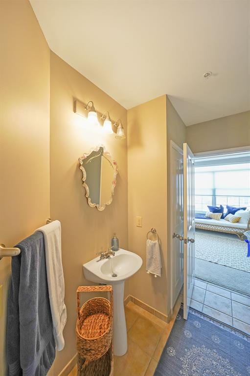 bathroom with tile patterned flooring and sink