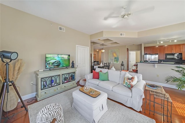 living room featuring ceiling fan