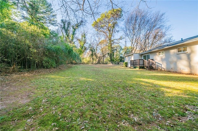 view of yard with a wooden deck