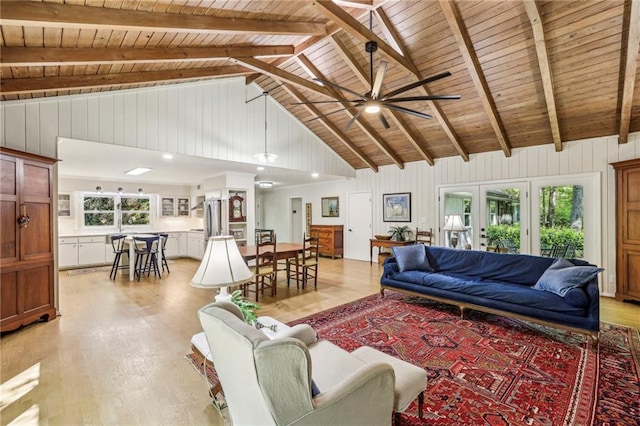 3311 Stillhouse Rd SE, Atlanta, GA 30339 - living room featuring wooden ceiling with exposed beams, light wood-style flooring, a ceiling fan, and high vaulted ceiling