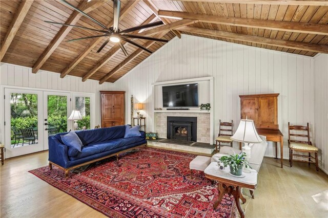 3311 Stillhouse Rd SE, Atlanta, GA 30339 - living room featuring wood finished floors, wooden ceiling, ceiling fan, a fireplace, and wooden walls