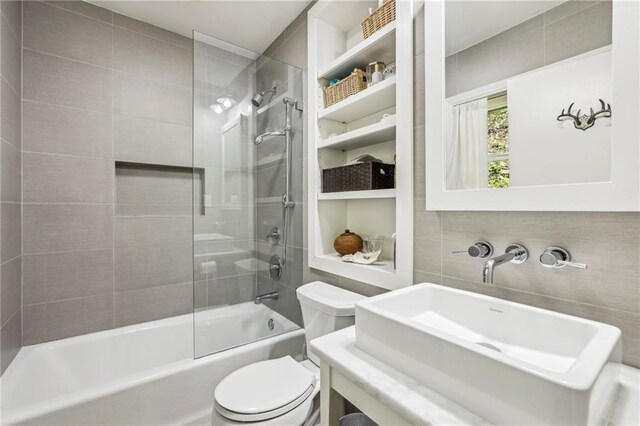 3311 Stillhouse Rd SE, Atlanta, GA 30339 - bathroom with a sink, toilet, tub / shower combination, and tile walls