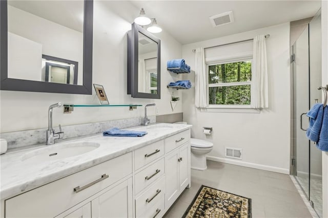 3311 Stillhouse Rd SE, Atlanta, GA 30339 - full bathroom featuring toilet, a shower stall, baseboards, and double vanity