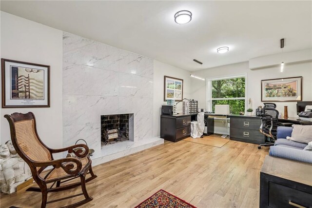 3311 Stillhouse Rd SE, Atlanta, GA 30339 - office area with light wood-style floors and a premium fireplace