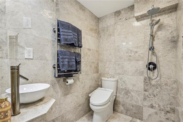 3311 Stillhouse Rd SE, Atlanta, GA 30339 - full bath featuring a tile shower, a sink, toilet, and tile walls