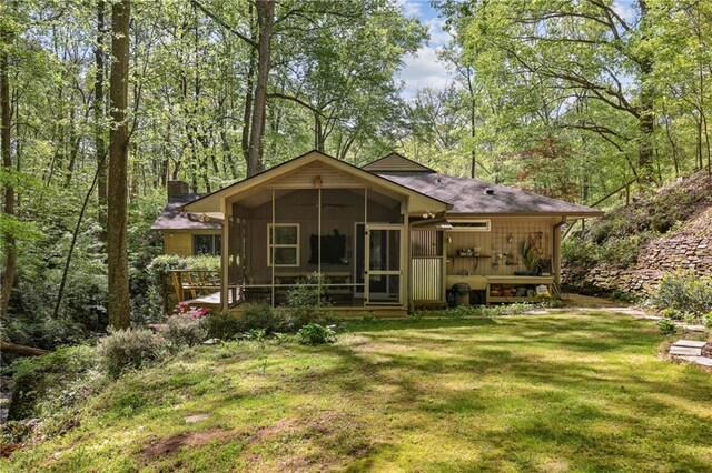 3311 Stillhouse Rd SE, Atlanta, GA 30339 - view of front of home with a sunroom, a chimney, and a front yard