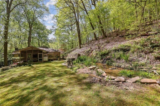 3311 Stillhouse Rd SE, Atlanta, GA 30339 - view of green lawn with a sunroom