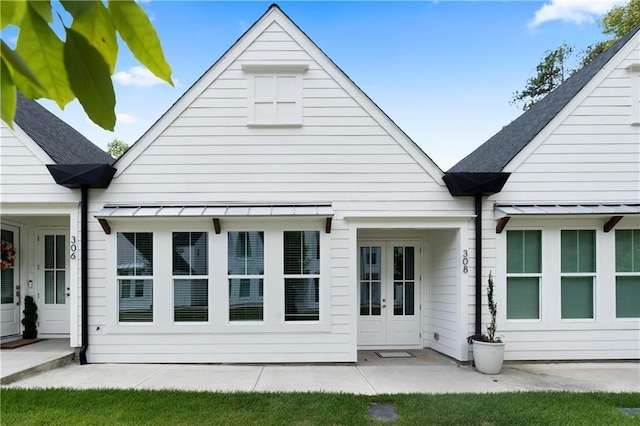 back of property featuring french doors and a patio