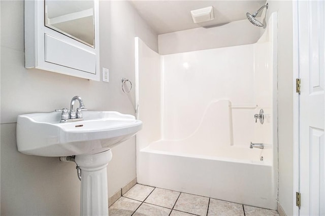 bathroom with tile patterned flooring and tub / shower combination