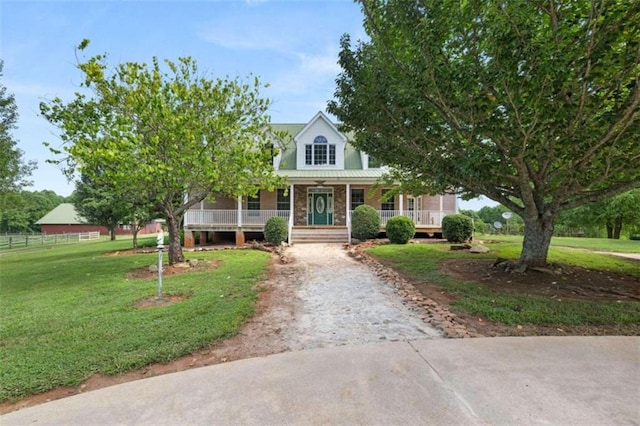 view of front facade with covered porch and a front lawn