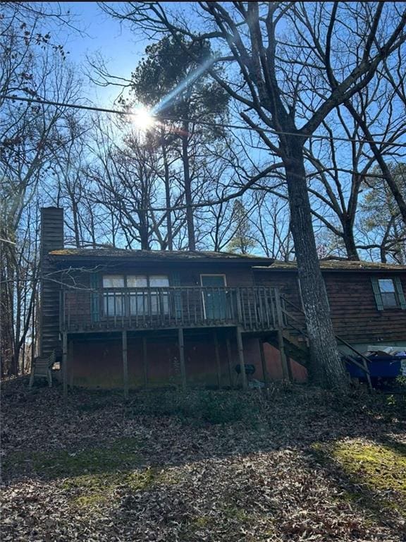 back of house featuring a deck