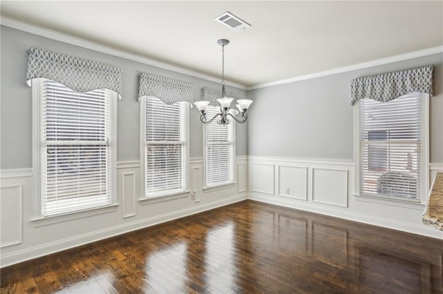 unfurnished dining area featuring dark hardwood / wood-style floors and an inviting chandelier