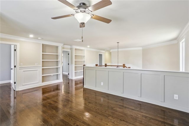 spare room featuring ornamental molding, dark wood-type flooring, and ceiling fan