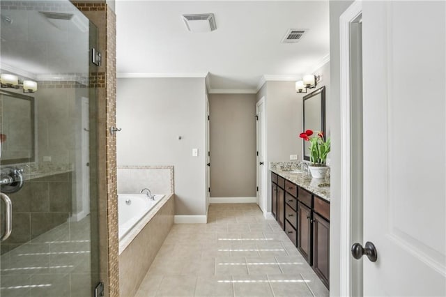 bathroom with plus walk in shower, vanity, crown molding, and tile patterned floors