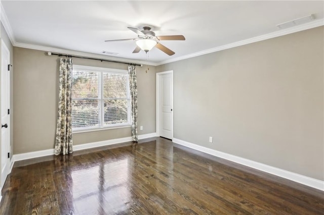 empty room featuring ceiling fan, crown molding, and dark wood-type flooring