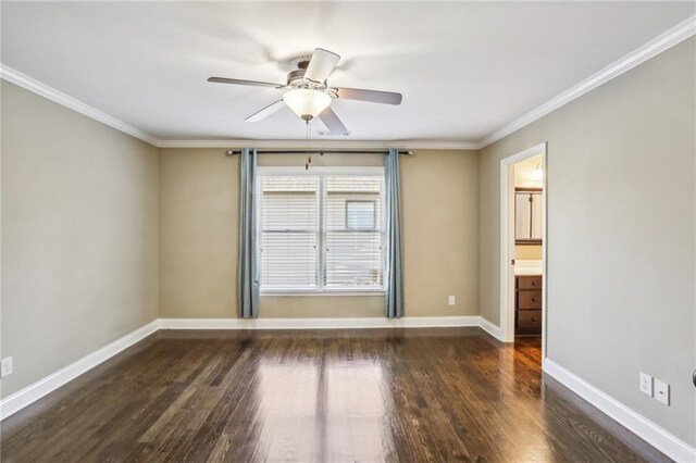 empty room featuring ceiling fan, crown molding, and dark hardwood / wood-style floors