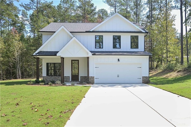 view of front of house featuring a garage and a front lawn