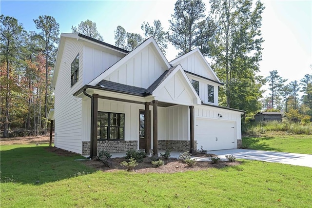 view of front of home with a garage and a front lawn