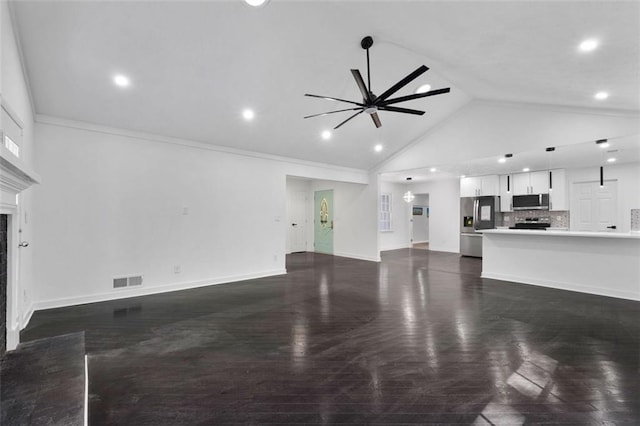 living room with ceiling fan, a premium fireplace, dark hardwood / wood-style flooring, high vaulted ceiling, and ornamental molding