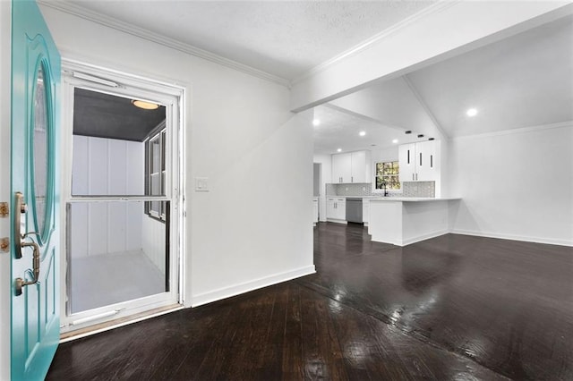 interior space with crown molding, dark wood-type flooring, and lofted ceiling