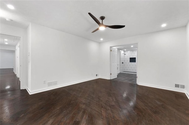 unfurnished living room with dark hardwood / wood-style floors and ceiling fan