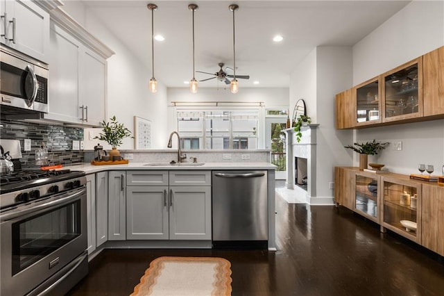 616 Angier Ave NE Unit 4, Atlanta, GA 30308 - kitchen featuring appliances with stainless steel finishes, a peninsula, gray cabinets, light countertops, and tasteful backsplash