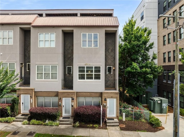 616 Angier Ave NE Unit 4, Atlanta, GA 30308 - multi unit property with stucco siding, entry steps, a metal roof, and brick siding