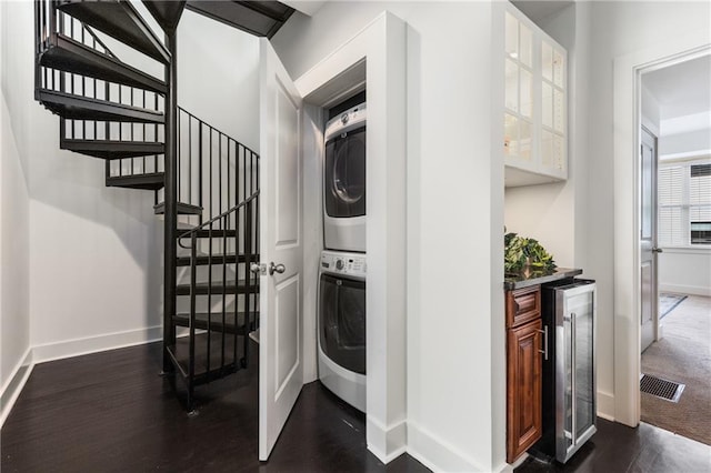 616 Angier Ave NE Unit 4, Atlanta, GA 30308 - laundry room featuring stacked washer and clothes dryer, wine cooler, dark wood-style flooring, and bar