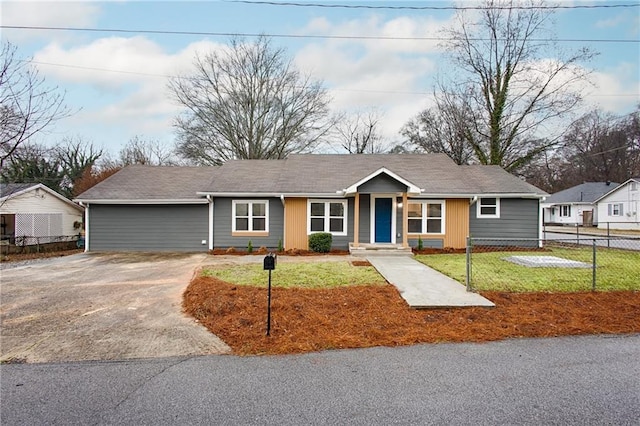 ranch-style home featuring a front yard