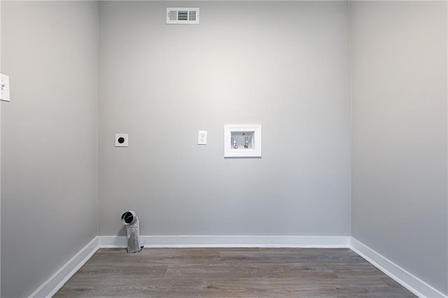 laundry room featuring hookup for a washing machine, wood-type flooring, and electric dryer hookup