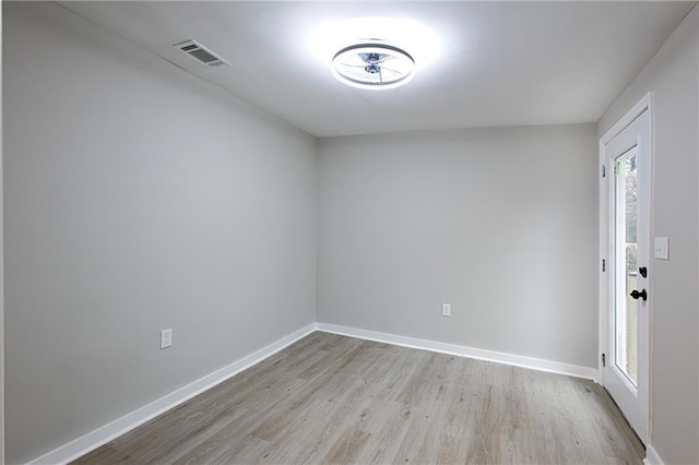 unfurnished room with light hardwood / wood-style floors