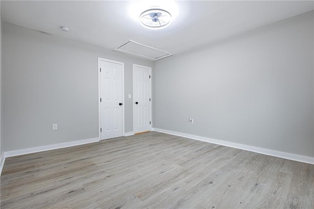 spare room with light hardwood / wood-style floors