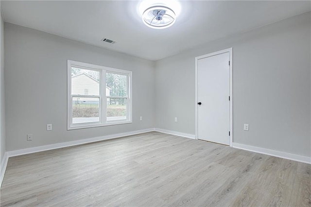 spare room with light hardwood / wood-style floors