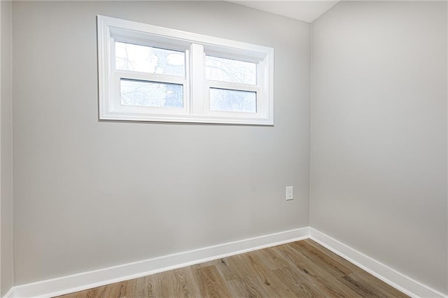 spare room with light hardwood / wood-style floors