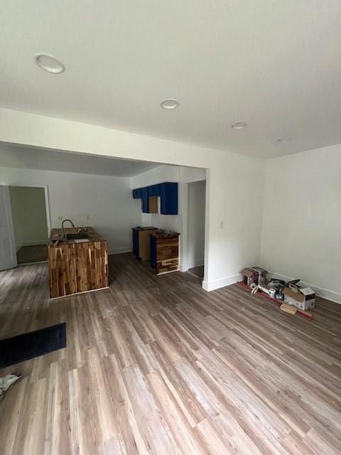 451 Collier Ridge Dr NW, Atlanta, GA 30318 - unfurnished living room with wood finished floors and recessed lighting