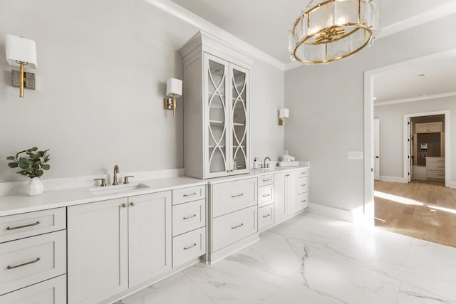 bathroom featuring crown molding and vanity