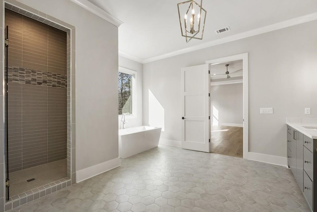 bathroom with plus walk in shower, tile patterned floors, vanity, ceiling fan with notable chandelier, and ornamental molding