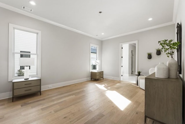 bedroom with light hardwood / wood-style flooring and ornamental molding