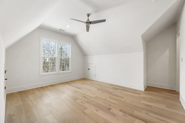 bonus room featuring ceiling fan, lofted ceiling, and light wood-type flooring